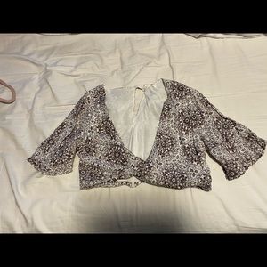 light crop top with a dipped down front